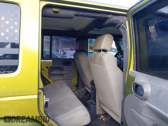 2007 Jeep Wrangler Unlimited Sahara with VIN 1J4GA59187L189519, listed as a IAAI auction lot 41204036 with 165,428 mi miles and . Bid and sale history available at DreamBid. Image 8.