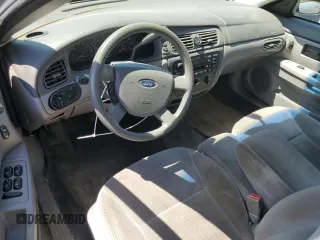 2005 Ford Taurus SE with VIN 1FAFP53U25A303516, listed as a Copart auction lot 63250505 with 203,463 mi miles and Salvage title. Bid and sale history available at DreamBid. Image 8.