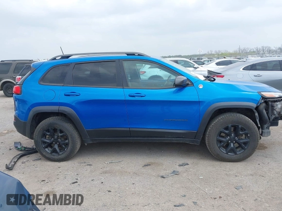 2018 Jeep Cherokee Trailhawk with VIN 1C4PJMBX6JD569684, listed as a IAAI auction lot 41925325 with 149,446 mi miles and . Bid and sale history available at DreamBid. Image 14.