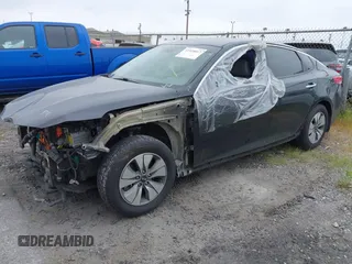 2017 Kia Optima Hybrid with VIN KNAGT4LEXH5014570, listed as a IAAI auction lot 41910017 with 126,532 mi miles. Bid and sale history available at carsss.com. Image 2.