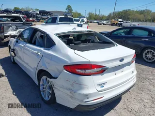 2020 Ford Fusion SE z VIN 3FA6P0LU8LR266686, wystawiony jako IAAI lot #41790126 z przebiegiem 95 314 mil mil oraz . Historia ofert i sprzedaży dostępna na DreamBid. Obrazek 3.