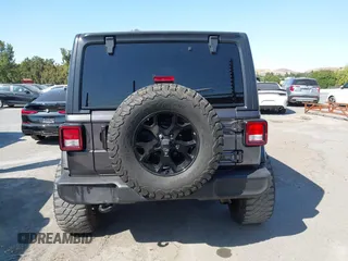 2021 Jeep Wrangler Unlimited Willys с VIN 1C4HJXDG7MW576798, выставлен на аукционе IAAI как лот 42471651 с пробегом 58 481 миль миль и . История ставок и продаж доступна на DreamBid. Изображение 16.