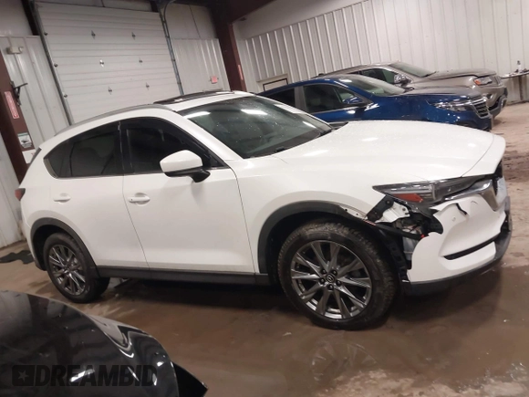 2019 Mazda CX-5 Signature with VIN JM3KFBEY5K0520593, listed as a IAAI auction lot 41638594 with 111,504 mi miles. Bid and sale history available at carsss.com. Image 13.