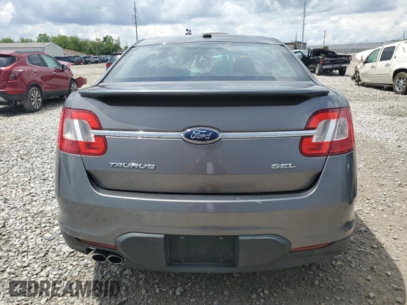 2011 Ford Taurus SEL z VIN 1FAHP2EWXBG190610, wystawiony jako Copart lot #56993785 z przebiegiem 119 784 mil mil oraz Szkoda całkowita • Salvage title. Historia ofert i sprzedaży dostępna na DreamBid. Obrazek 6.