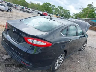2014 Ford Fusion S with VIN 3FA6P0G73ER353967, listed as a IAAI auction lot 42014604 with 132,340 mi miles. Bid and sale history available at carsss.com. Image 4.