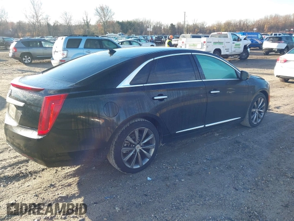 2013 Cadillac XTS z VIN 2G61N5S32D9238652, wystawiony jako IAAI lot #40966692 z przebiegiem 90 834 mil mil oraz . Historia ofert i sprzedaży dostępna na DreamBid. Obrazek 4.