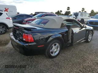 2004 Ford Mustang Deluxe with VIN 1FAFP44414F125267, listed as a Copart auction lot 74595714 with 0 mi miles and Salvage Title. Bid and sale history available at carsss.com. Image 3.