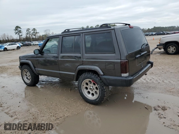 1999 Jeep Cherokee Sport with VIN 1J4FT68S2XL656679, listed as a Copart auction lot 88145875 with 254,038 mi miles and Salvage title. Bid and sale history available at DreamBid. Image 2.