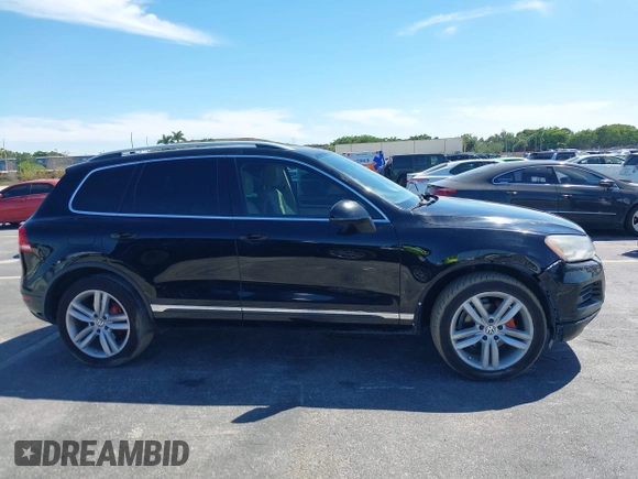 2013 Volkswagen Touareg Lux with VIN WVGEF9BP6DD004454, listed as a IAAI auction lot 41862958 with 239,548 mi miles and . Bid and sale history available at DreamBid. Image 13.