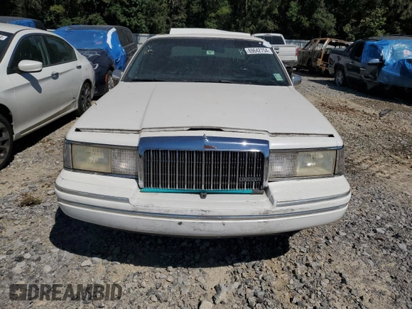1994 Lincoln Town Car Signature z VIN 1LNLM82W7RY781174, wystawiony jako Copart lot #69642754 z przebiegiem 149 185 mil mil oraz Szkoda całkowita • Salvage title. Historia ofert i sprzedaży dostępna na DreamBid. Obrazek 5.