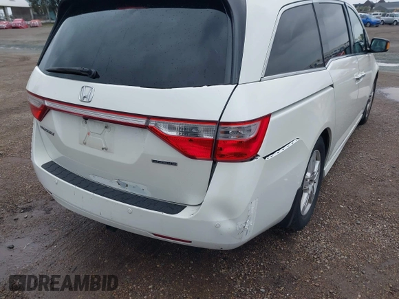 2013 Honda Odyssey Touring with VIN 5FNRL5H99DB041328, listed as a IAAI auction lot 41797520 with 148,523 mi miles and . Bid and sale history available at carsss.com. Image 6.
