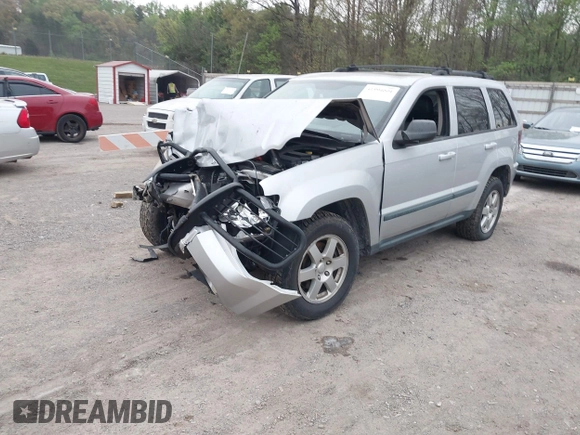 2009 Jeep Grand Cherokee Laredo with VIN 1J8GR48K09C557139, listed as a IAAI auction lot 41994604 with 1 mi miles. Bid and sale history available at carsss.com. Image 2.