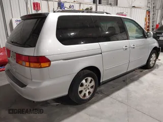 2003 Honda Odyssey EX with VIN 5FNRL18673B009670, listed as a IAAI auction lot 42130172 with 218,391 mi miles and . Bid and sale history available at DreamBid. Image 4.