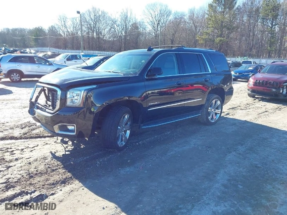 2017 GMC Yukon Denali with VIN 1GKS2CKJ6HR297412, listed as a IAAI auction lot 41330984 with 99,472 mi miles. Bid and sale history available at carsss.com. Image 2.