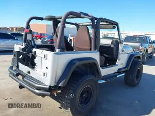 2002 Jeep Wrangler X with VIN 1J4FA39S42P763835, listed as a IAAI auction lot 42302645 with 233,634 mi miles and . Bid and sale history available at DreamBid. Image 4.
