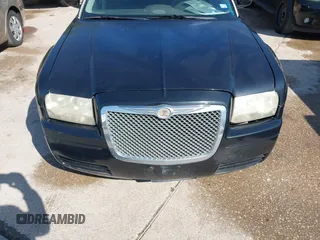2005 Chrysler 300 with VIN 2C3JA43R65H668010, listed as a IAAI auction lot 41976405 with 216,099 mi miles. Bid and sale history available at carsss.com. Image 6.