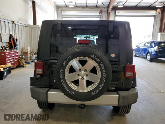 2008 Jeep Wrangler Unlimited Sahara with VIN 1J4GA59108L637009, listed as a Copart auction lot 63333705 with 181,778 mi miles and Clean title. Bid and sale history available at DreamBid. Image 6.
