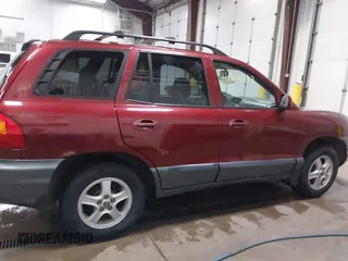 2003 Hyundai Santa Fe GLS with VIN KM8SC73D63U368408, listed as a IAAI auction lot 41514597 with 137,895 mi miles. Bid and sale history available at carsss.com. Image 14.