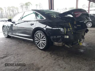 2019 Audi A8 L with VIN WAU8DAF8XKN013139, listed as a IAAI auction lot 41662195 with 38,442 mi miles. Bid and sale history available at carsss.com. Image 3.