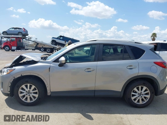 2014 Mazda CX-5 Touring z VIN JM3KE2CYXE0322943, wystawiony jako IAAI lot #41934670 z przebiegiem 110 690 mil mil oraz . Historia ofert i sprzedaży dostępna na DreamBid. Obrazek 14.