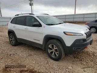 2014 Jeep Cherokee Trailhawk with VIN 1C4PJMBS7EW183855, listed as a Copart auction lot 46143085 with 146,901 mi miles and Salvage Title. Bid and sale history available at DreamBid. Image 4.