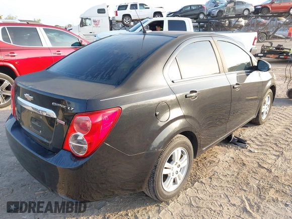 2014 Chevrolet Sonic LT z VIN 1G1JC5SB2E4223141, wystawiony jako IAAI lot #41872526 z przebiegiem 154 026 mil mil oraz . Historia ofert i sprzedaży dostępna na DreamBid. Obrazek 4.