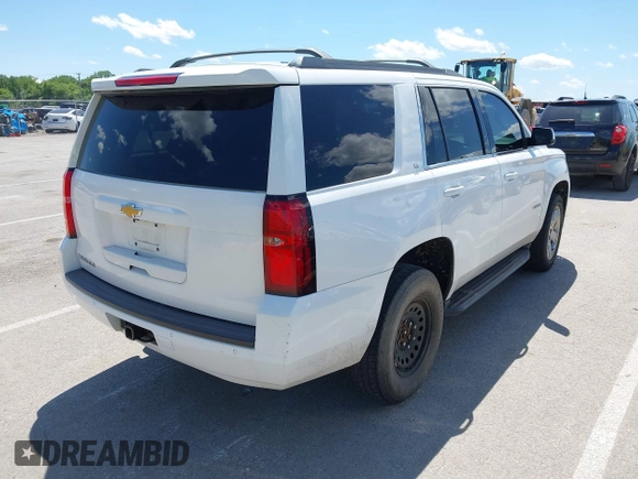 2015 Chevrolet Tahoe LT with VIN 1GNSKBKC8FR194164, listed as a IAAI auction lot 42315215 with 211,797 mi miles and . Bid and sale history available at DreamBid. Image 4.