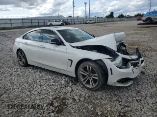 2015 BMW 4 Series 428i xDrive with VIN WBA4A7C53FD415066, listed as a Copart auction lot 61880545 with 130,874 mi miles and Salvage title. Bid and sale history available at DreamBid. Image 4.