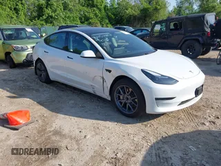 2023 Tesla Model 3 with VIN 5YJ3E1EA3PF617460, listed as a IAAI auction lot 42154401 with 9,578 mi miles and . Bid and sale history available at DreamBid. Image 1.