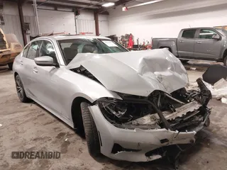 2019 BMW 3 Series 330i xDrive with VIN WBA5R7C53KAJ86493, listed as a IAAI auction lot 41559974 with 55,391 mi miles. Bid and sale history available at carsss.com. Image 1.