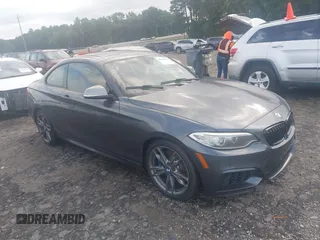 2015 BMW 2 Series M235i with VIN WBA1J7C5XFV289379, listed as a IAAI auction lot 42670817 with 89,895 mi miles and . Bid and sale history available at DreamBid. Image 1.