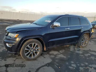 2017 Jeep Grand Cherokee Overland with VIN 1C4RJFCT0HC952052, listed as a Copart auction lot 85064124 with 184,206 mi miles and Salvage Title. Bid and sale history available at carsss.com. Image 1.