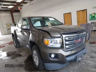 2015 GMC Canyon 4WD SLE with VIN 1GTG6BE39F1142488, listed as a IAAI auction lot 42515035 with 99,709 mi miles and . Bid and sale history available at DreamBid. Image 1.