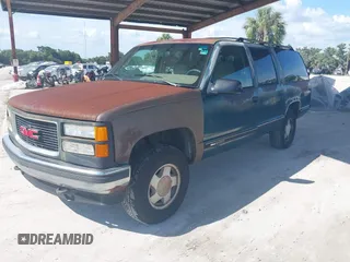 1995 GMC Suburban z VIN 1GKFK16K9SJ728534, wystawiony jako IAAI lot #42358029 z przebiegiem 279 148 mil mil oraz . Historia ofert i sprzedaży dostępna na DreamBid. Obrazek 2.