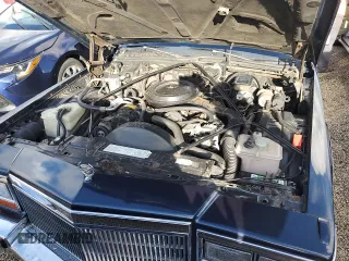 1989 Cadillac Brougham z VIN 1G6DW51Y6KR723841, wystawiony jako Copart lot #74548864 z przebiegiem 74 705 mil mil oraz Szkody całkowita. Historia ofert i sprzedaży dostępna na DreamBid. Obrazek 11.