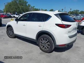 2018 Mazda CX-5 Grand Touring with VIN JM3KFADM2J1422512, listed as a IAAI auction lot 42010801 with 48,567 mi miles and . Bid and sale history available at DreamBid. Image 3.