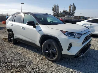 2021 Toyota RAV4 Hybrid XSE with VIN 2T3E6RFV1MW018990, listed as a Copart auction lot 64043865 with 55,938 mi miles and Salvage title. Bid and sale history available at DreamBid. Image 4.