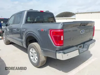 2023 Ford F-150 XL with VIN 1FTFW1E87PKF04735, listed as a IAAI auction lot 42048913 with 54,893 mi miles. Bid and sale history available at carsss.com. Image 3.