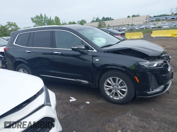 2024 Cadillac XT6 AWD Luxury z VIN 1GYKPBR49RZ723838, wystawiony jako IAAI lot #42346554 z przebiegiem 27 525 mil mil oraz . Historia ofert i sprzedaży dostępna na DreamBid. Obrazek 13.