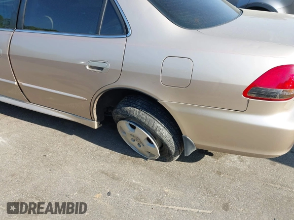 2002 Honda Accord EX z VIN 1HGCG16572A033397, wystawiony jako IAAI lot #42055022 z przebiegiem 225 073 mil mil oraz . Historia ofert i sprzedaży dostępna na DreamBid. Obrazek 13.