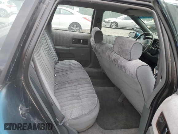 1991 Chevrolet Caprice z VIN 1G1BL83EXMW257393, wystawiony jako Copart lot #85267614 z przebiegiem 195 128 mil mil oraz Nie do naprawy • Non repairable. Historia ofert i sprzedaży dostępna na DreamBid. Obrazek 10.