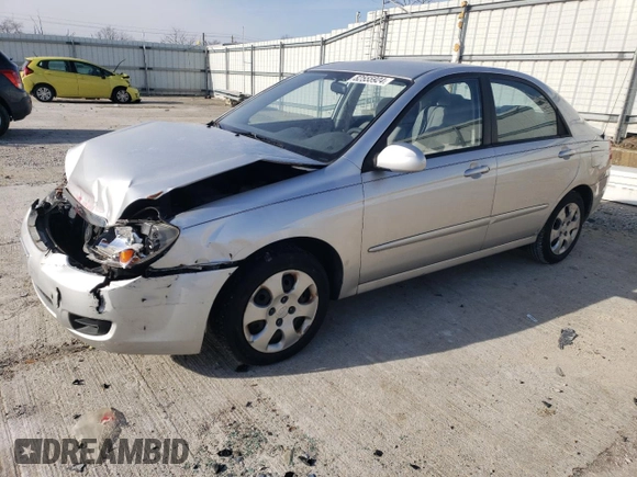 2009 Kia Spectra LX with VIN KNAFE221895659552, listed as a Copart auction lot 82555924 with 114,704 mi miles and Salvage Title. Bid and sale history available at carsss.com. Image 1.