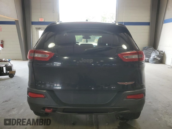 2014 Jeep Cherokee Trailhawk with VIN 1C4PJMBB8EW171116, listed as a Copart auction lot 60107215 with 168,979 mi miles and Salvage title. Bid and sale history available at DreamBid. Image 6.