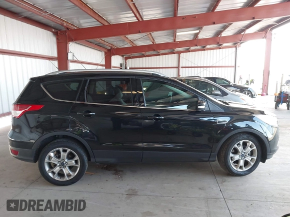 2015 Ford Escape Titanium with VIN 1FMCU0J98FUB95597, listed as a IAAI auction lot 41785188 with 84,141 mi miles. Bid and sale history available at carsss.com. Image 12.