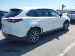 2019 Mazda CX-9 Touring with VIN JM3TCACY5K0306424, listed as a IAAI auction lot 42150466 with 95,166 mi miles and . Bid and sale history available at DreamBid. Image 4.