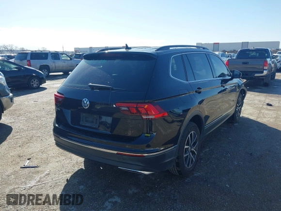2020 Volkswagen Tiguan SE with VIN 3VV3B7AX0LM106561, listed as a IAAI auction lot 41712689 with 85,374 mi miles and . Bid and sale history available at DreamBid. Image 4.