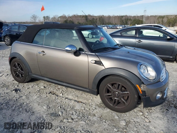 2011 MINI Convertible with VIN WMWZN3C53BT133576, listed as a Copart auction lot 87543835 with 69,999 mi miles and Salvage title. Bid and sale history available at DreamBid. Image 4.