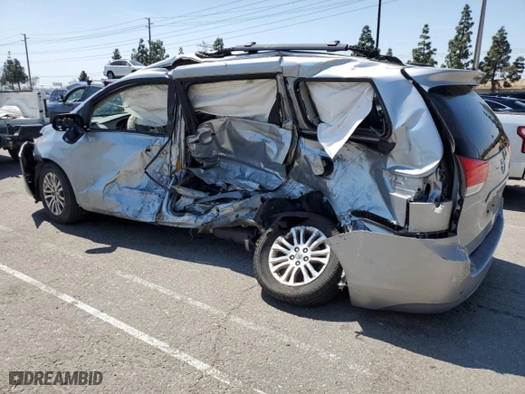 2014 Toyota Sienna XLE with VIN 5TDYK3DC7ES523796, listed as a Copart auction lot 52195795 with 0 mi miles and Salvage Title. Bid and sale history available at carsss.com. Image 2.
