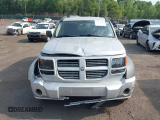 2010 Dodge Nitro SXT z VIN 1D4PU5GK8AW146087, wystawiony jako IAAI lot #42423104 z przebiegiem 220 381 mil mil oraz . Historia ofert i sprzedaży dostępna na DreamBid. Obrazek 12.