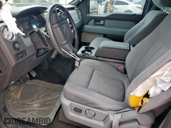 2012 Ford F-150 XL with VIN 1FTFW1ETXCFB32623, listed as a Copart auction lot 54597435 with 210,722 mi miles and Salvage Title. Bid and sale history available at DreamBid. Image 7.